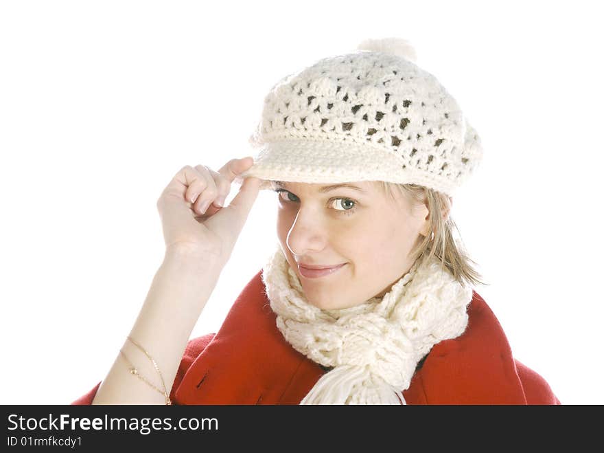 Young woman in a winter cap looking coquettishly isolated over white. Young woman in a winter cap looking coquettishly isolated over white