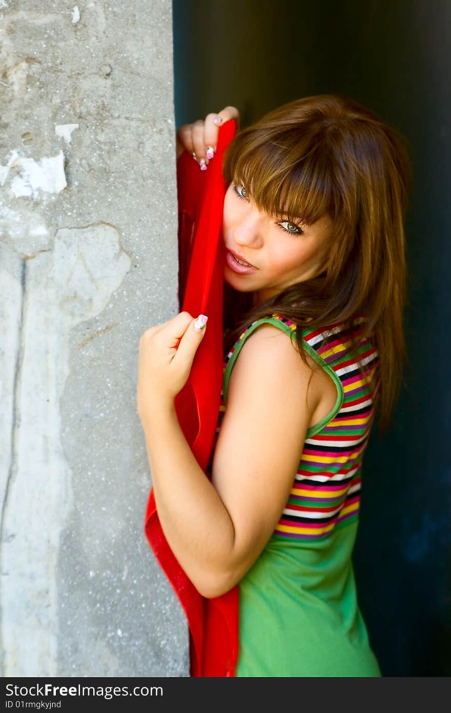 Portrait girl near grunge wall. Portrait girl near grunge wall