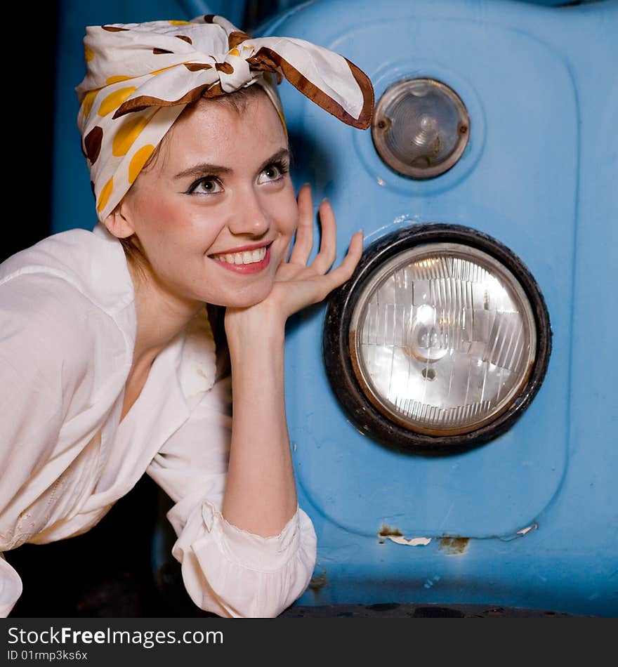 Portrait pin-up young woman from the car. Portrait pin-up young woman from the car