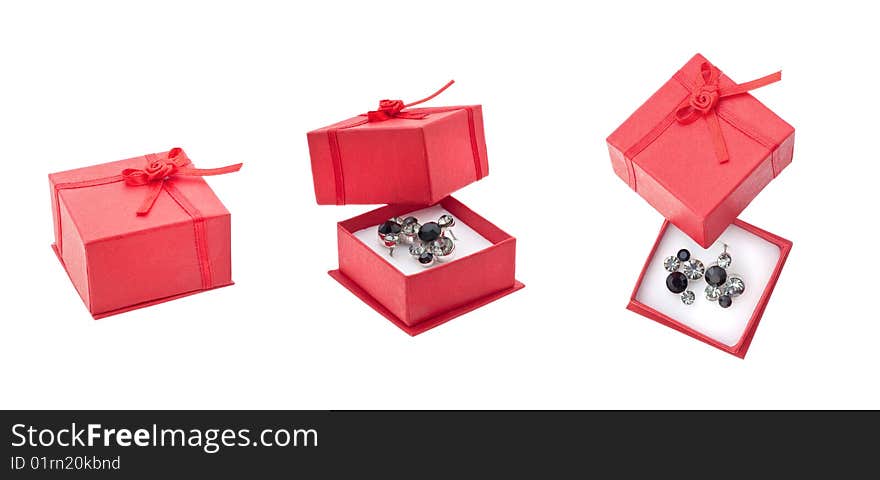 Earring in red present box isolated on white. Earring in red present box isolated on white