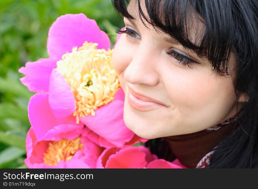 Portrait of the young nice girl with a flower. Portrait of the young nice girl with a flower