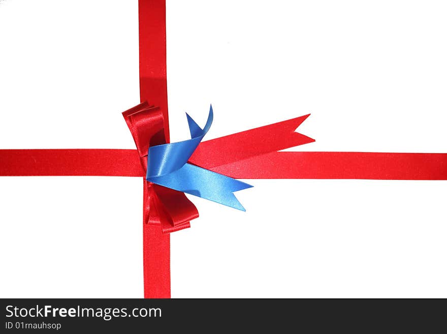 Red ribbon dressed like a present on a withe isolated background with copy space. Red ribbon dressed like a present on a withe isolated background with copy space