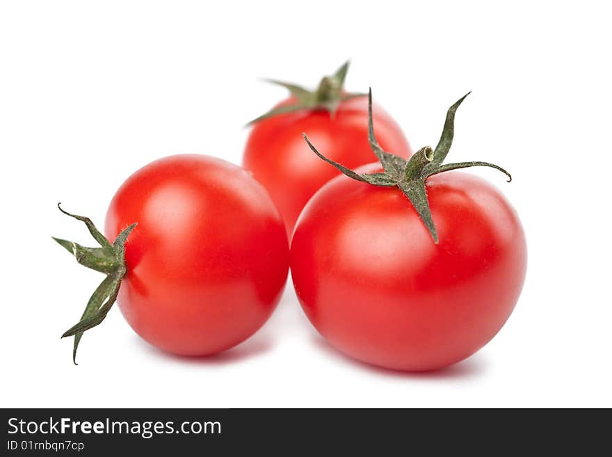 Ripe tomatoes isolated over white