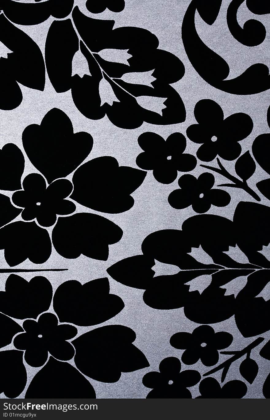 High resolution black flowers on silver metallic background