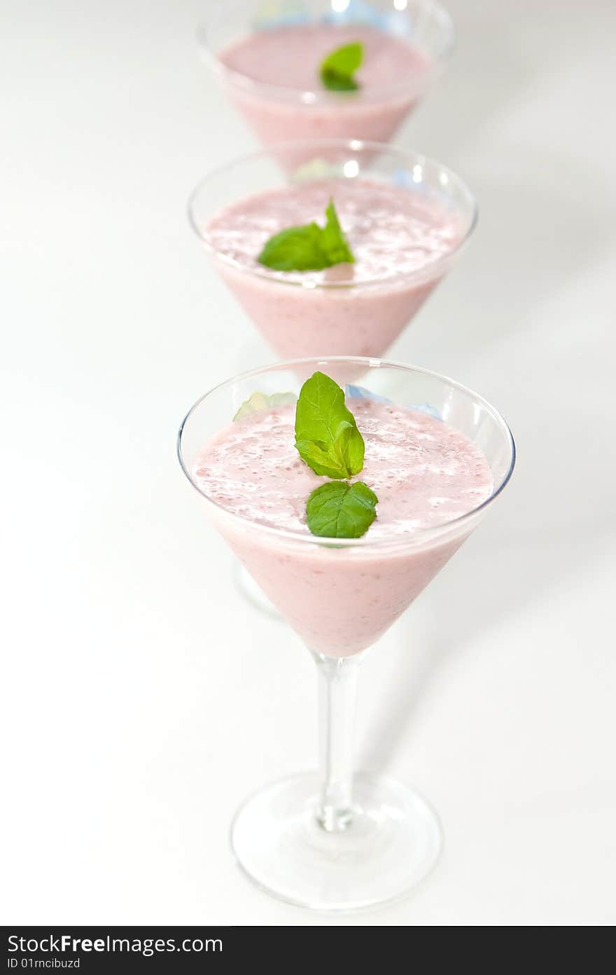 Smoothie made with strawberries decorated with mint. Smoothie made with strawberries decorated with mint