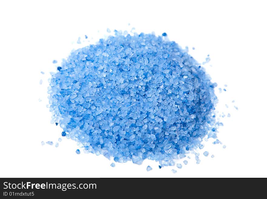 Heap of blue herbal salt isolated over white