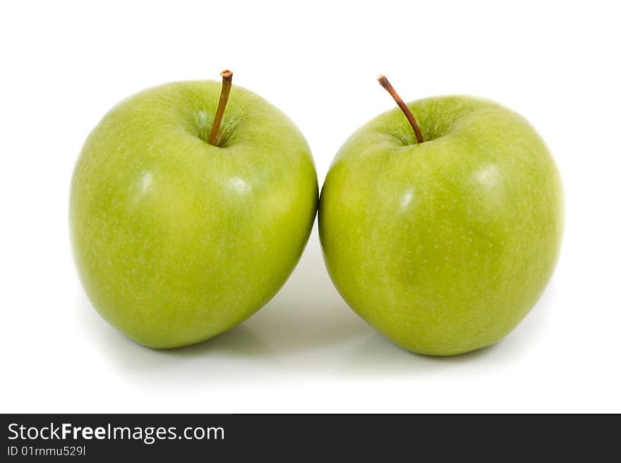 Two green apples on a white background