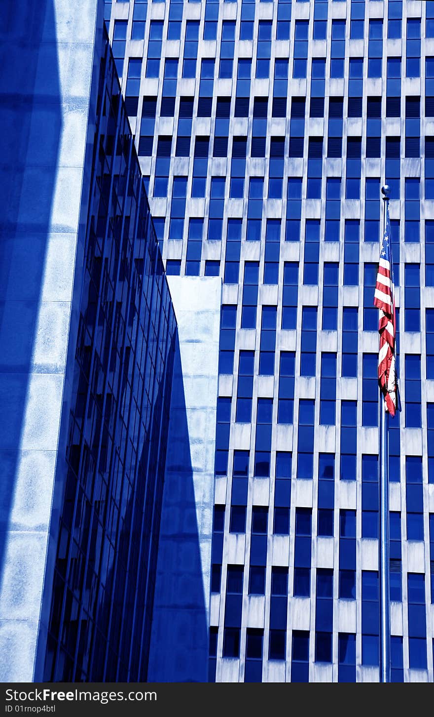 American building with flag colored by blue