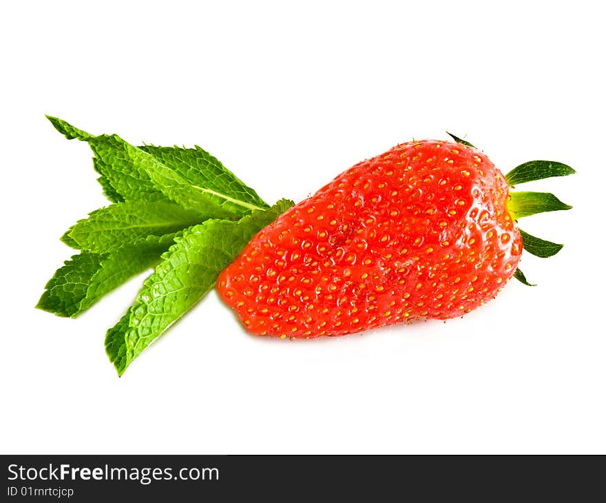 Ripe strawberry with a fresh leaf of mint on a white background