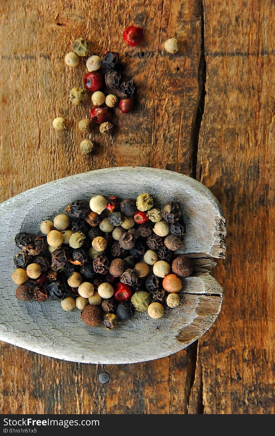 Colorful Peppercorns On A Wooden Spoon