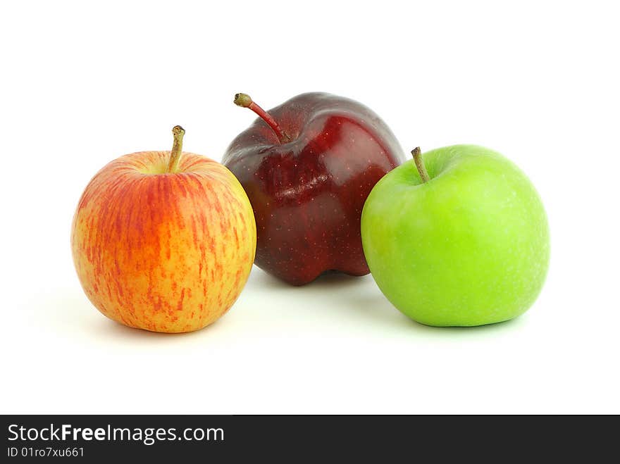 Three apples in different colour isolated on white background