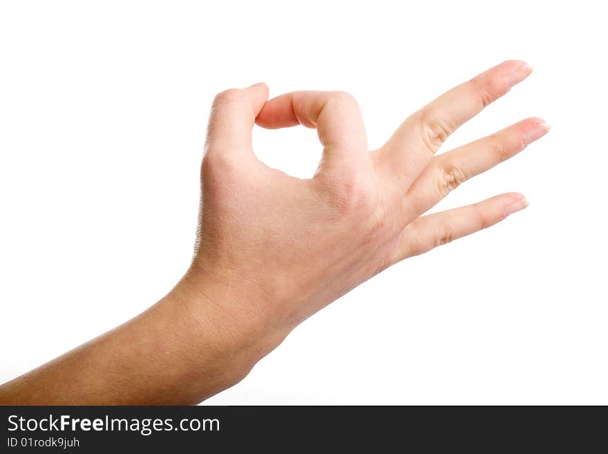 Female hand demonstrating OK gesture on the white background. Female hand demonstrating OK gesture on the white background