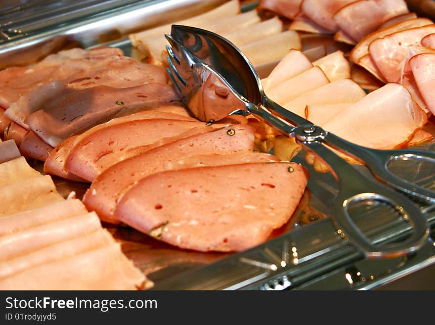 Salami for breakfast in shiny plate