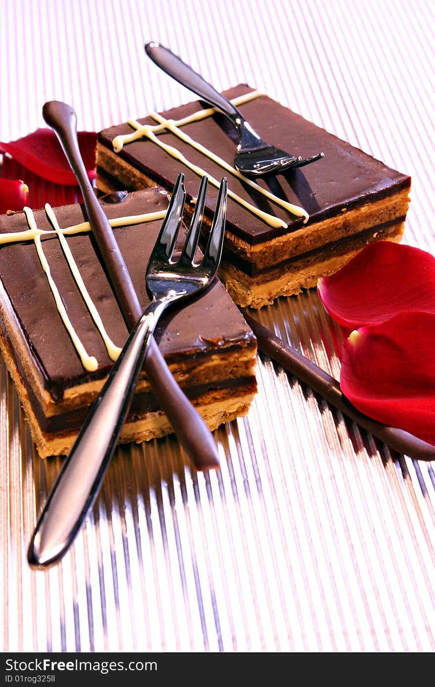 Chocolate cake on silver background