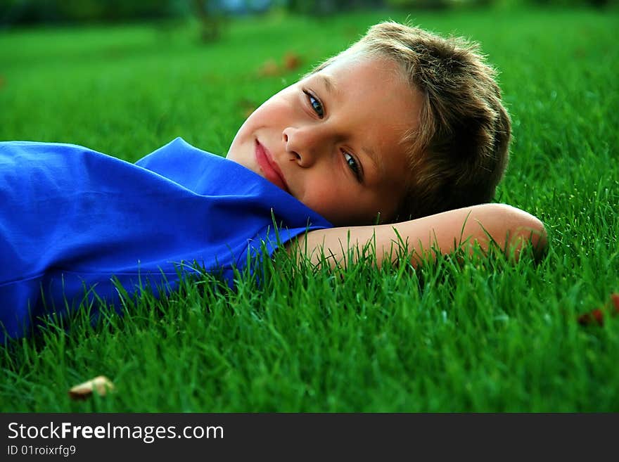 Boy laying on the grass