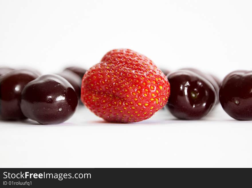 Mixed berries - strawberries, cherry on white. Mixed berries - strawberries, cherry on white