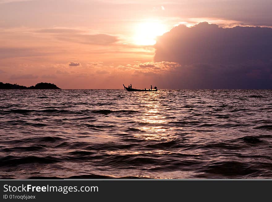 Longtail boat in sunset