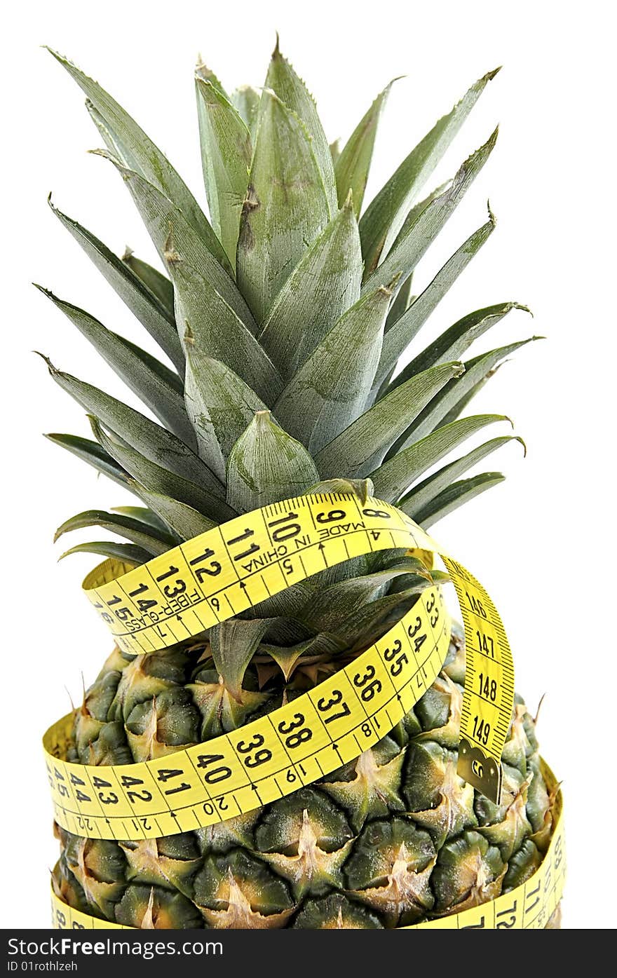 Pineapple with measuring tape isolated over white. Diet concept. Pineapple with measuring tape isolated over white. Diet concept.