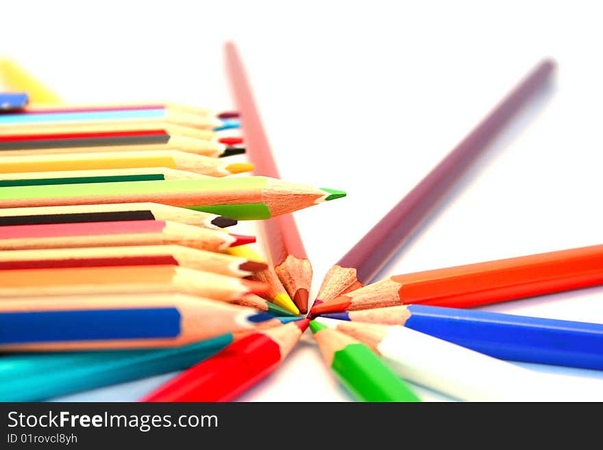 Colorful pencils on white background.