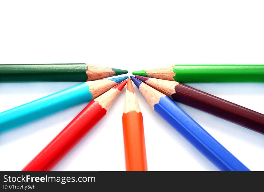 Colorful pencils on white background.