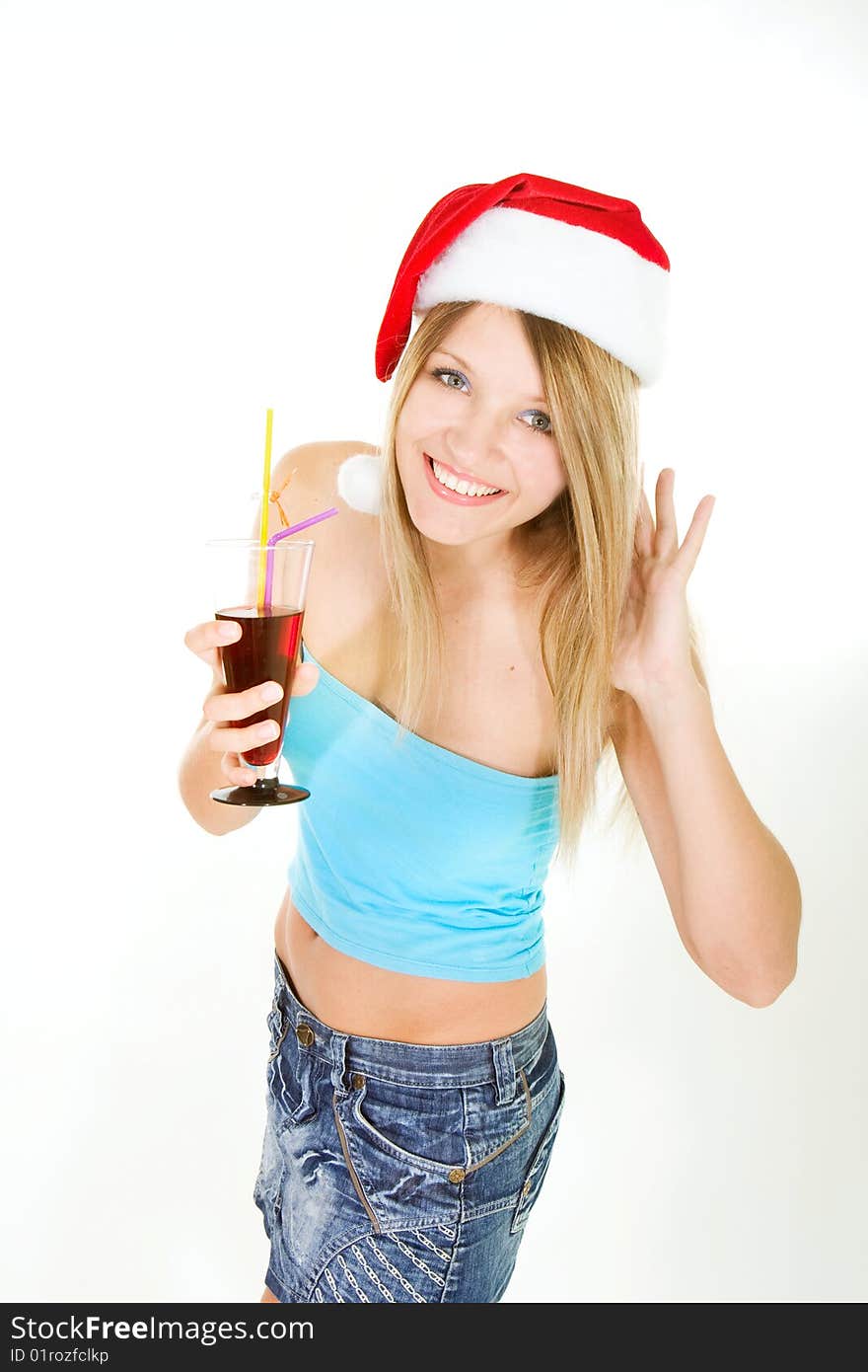 Santa girl with glass of juice over white