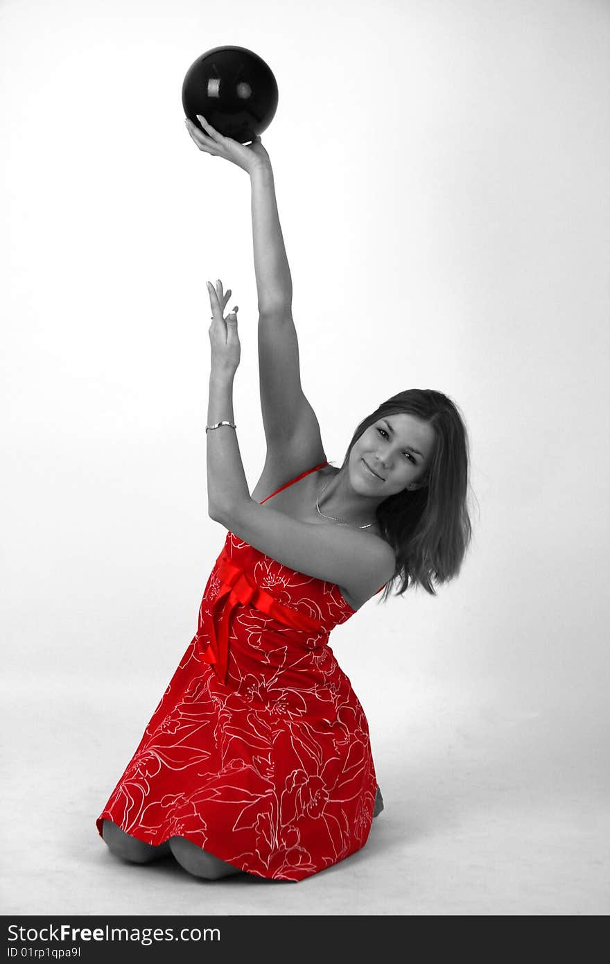 Elegant young woman in red-white outfit