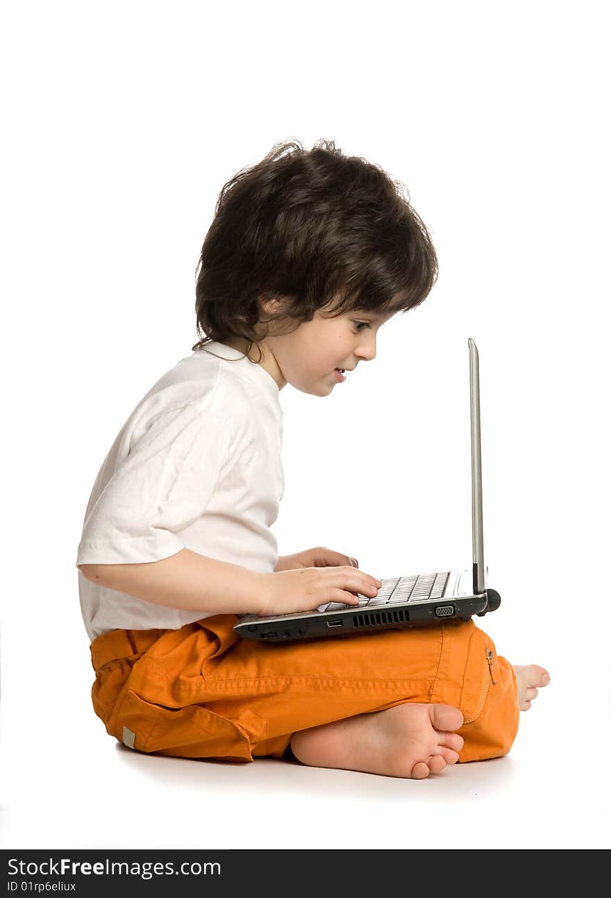 The merry boy with laptop on white background