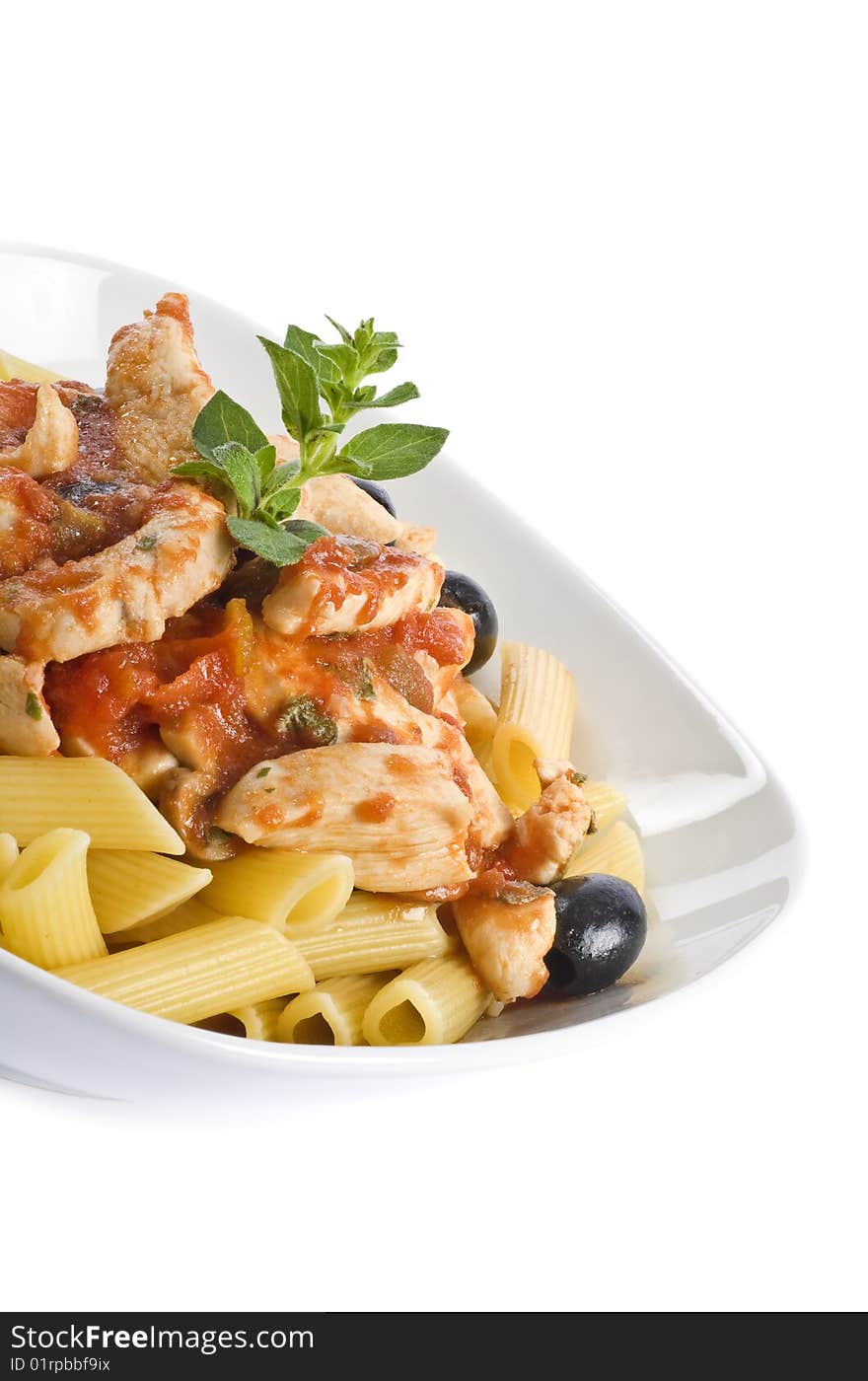 Delicious pasta with chicken strips, black olives, mushrooms, and fresh oregano in a tomato sauce. Delicious pasta with chicken strips, black olives, mushrooms, and fresh oregano in a tomato sauce.