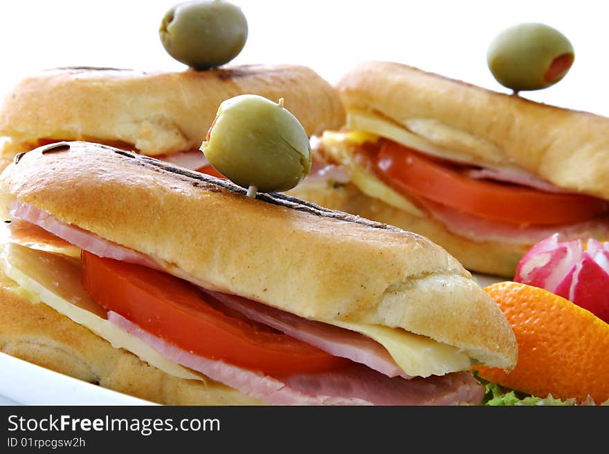 Sandwich with fresh vegetables on white plate