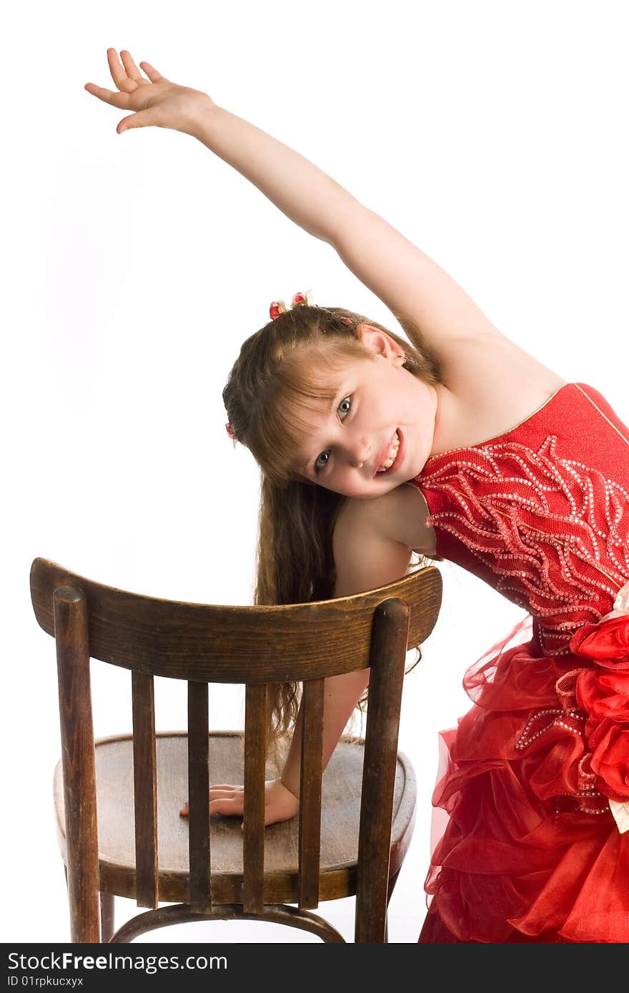 An image of a nice girl with brown chair. An image of a nice girl with brown chair