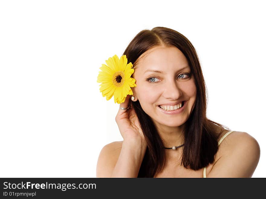 An image of a nice girl with a yellow flower in her hair. An image of a nice girl with a yellow flower in her hair