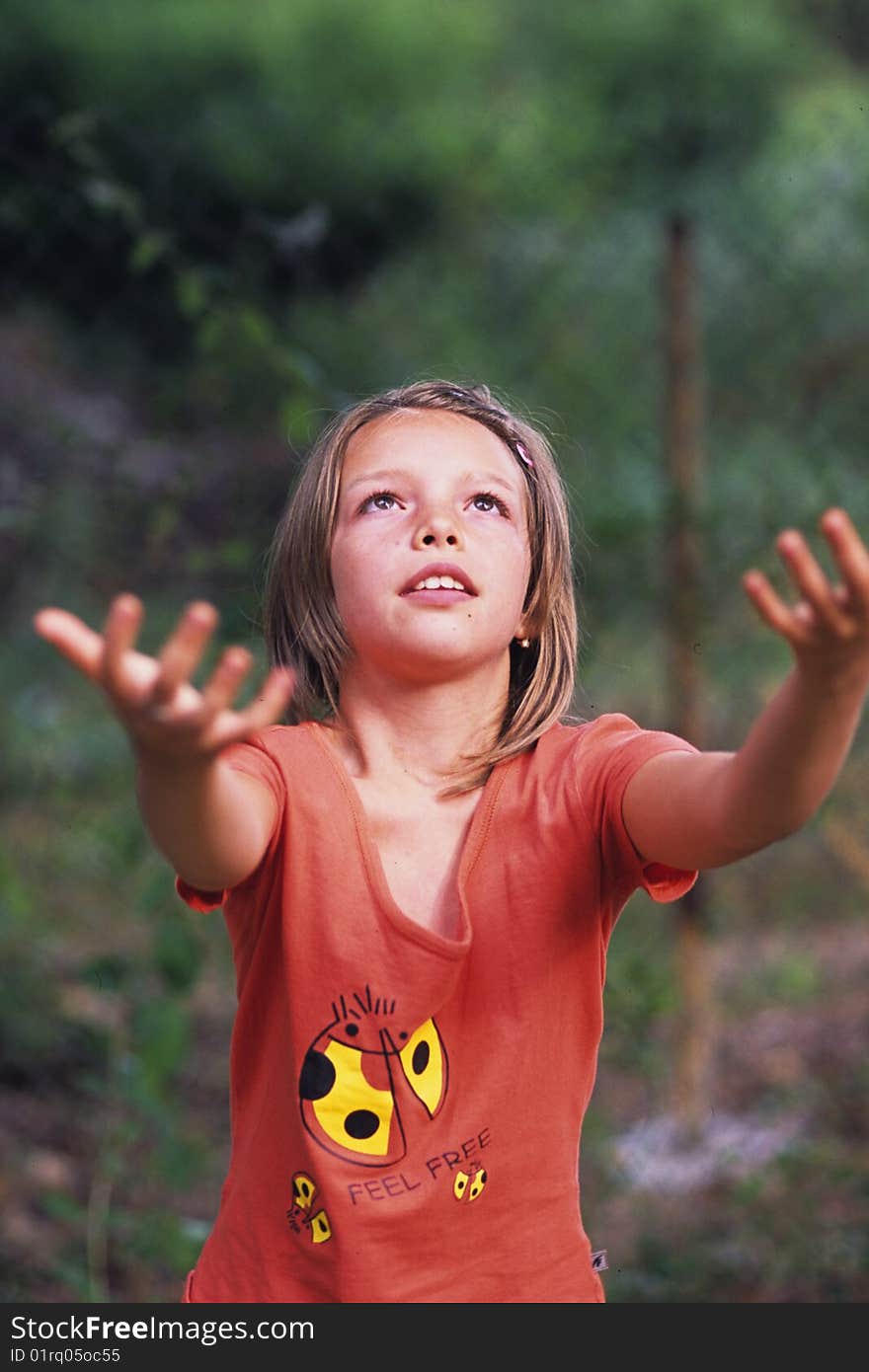 Girl playing in the garden and feeling free. Girl playing in the garden and feeling free