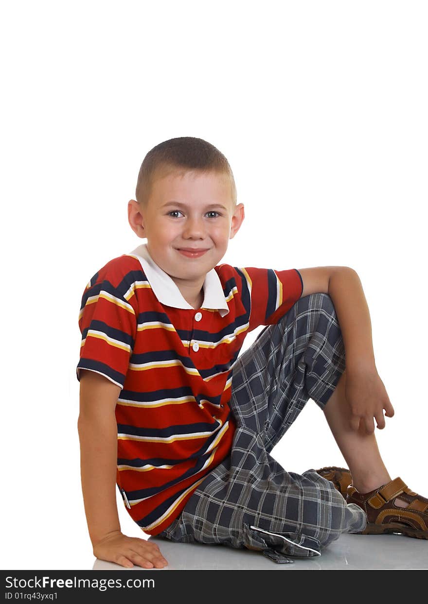 Portrait of the boy sitting on a floor. Portrait of the boy sitting on a floor