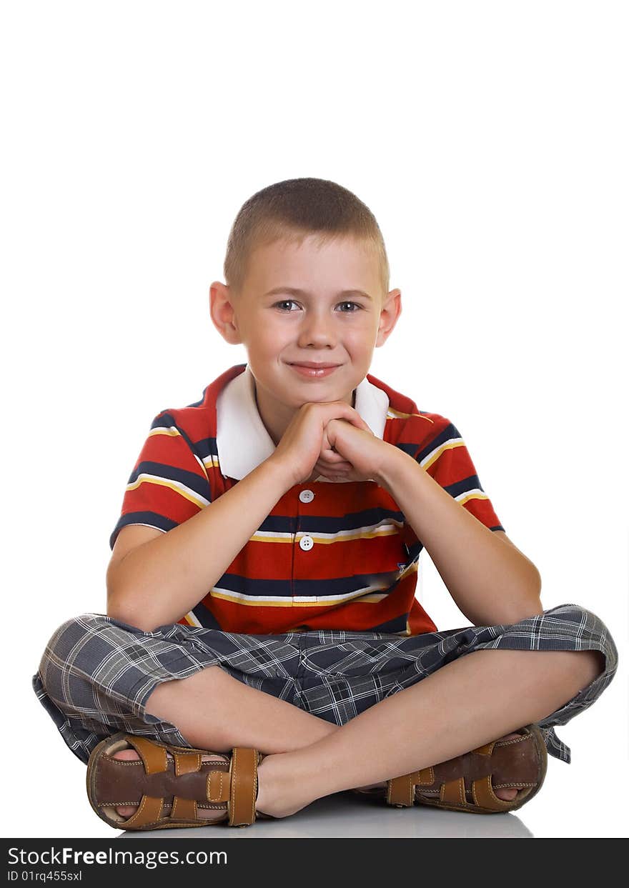 Portrait of the boy sitting on a floor. Portrait of the boy sitting on a floor