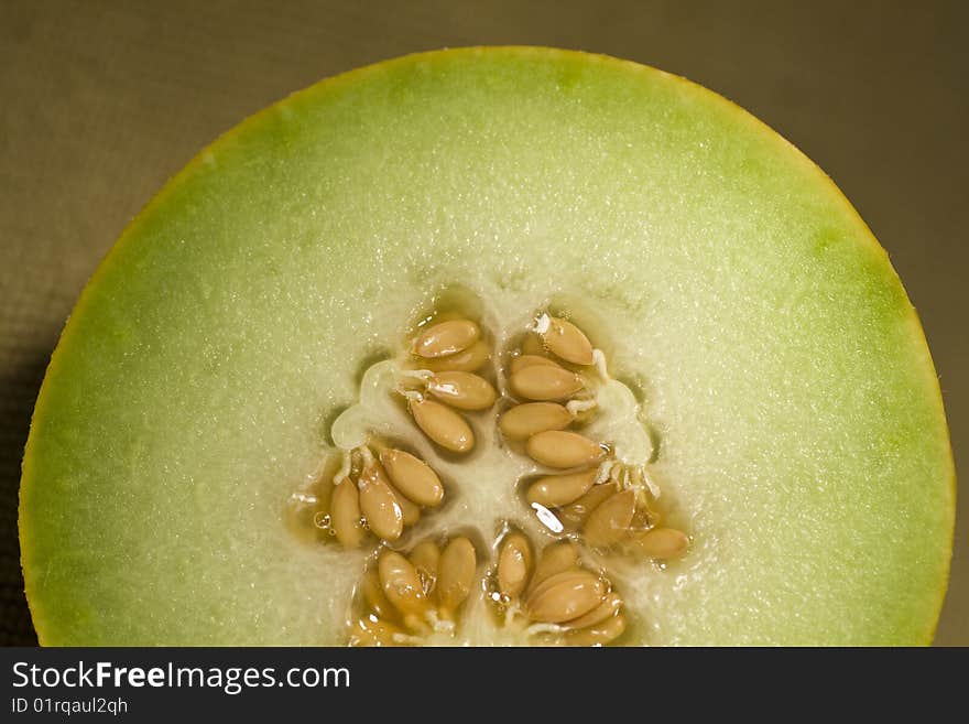 Closeup view of a sliced in half yellow melon. Closeup view of a sliced in half yellow melon.