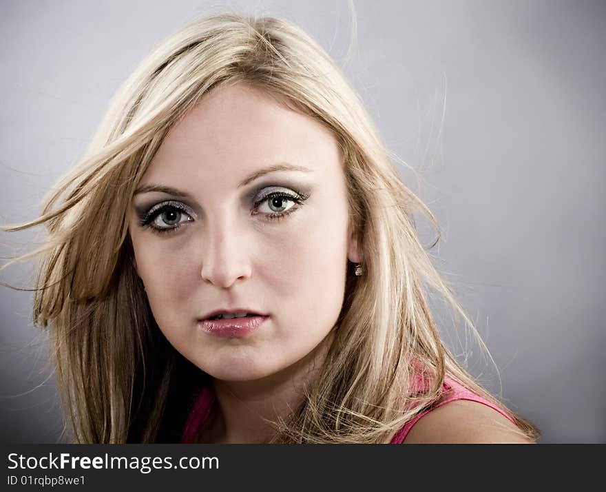 Great looking female model with hair blowing slightly and copy space. Great looking female model with hair blowing slightly and copy space.