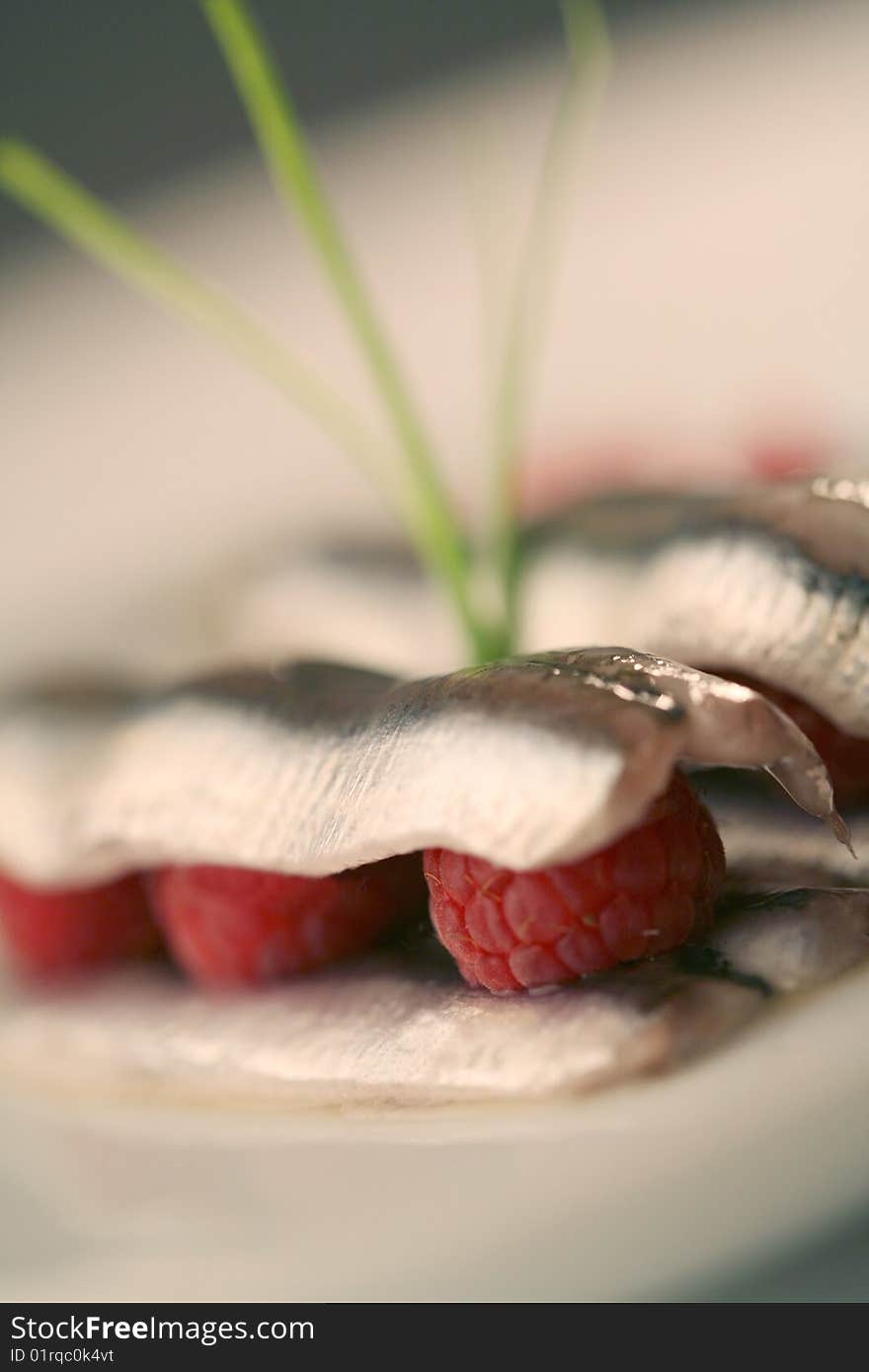 Anchovies  sandwich with red raspberries. Anchovies  sandwich with red raspberries