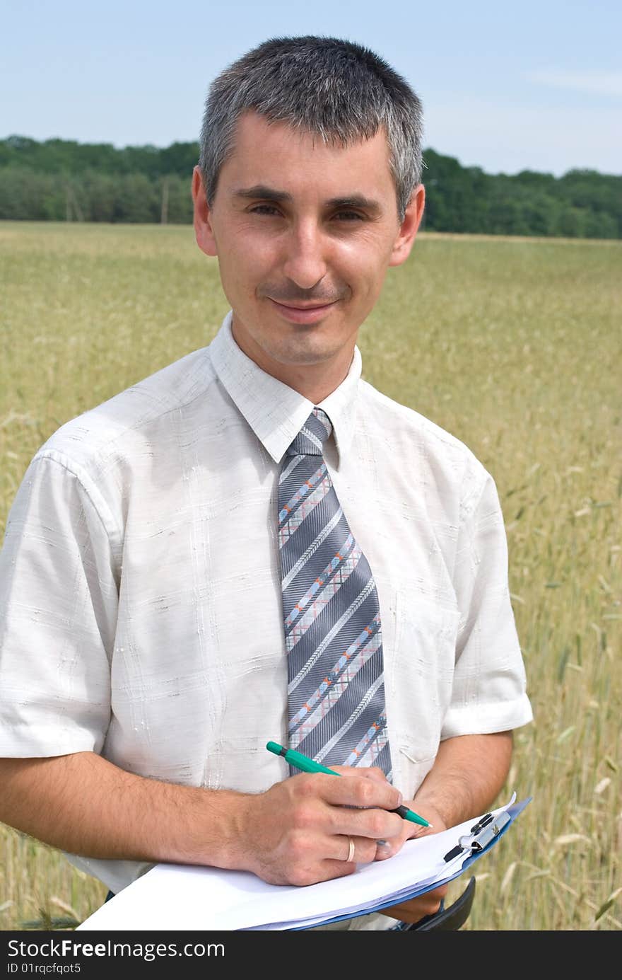 Man inspecting the wheat