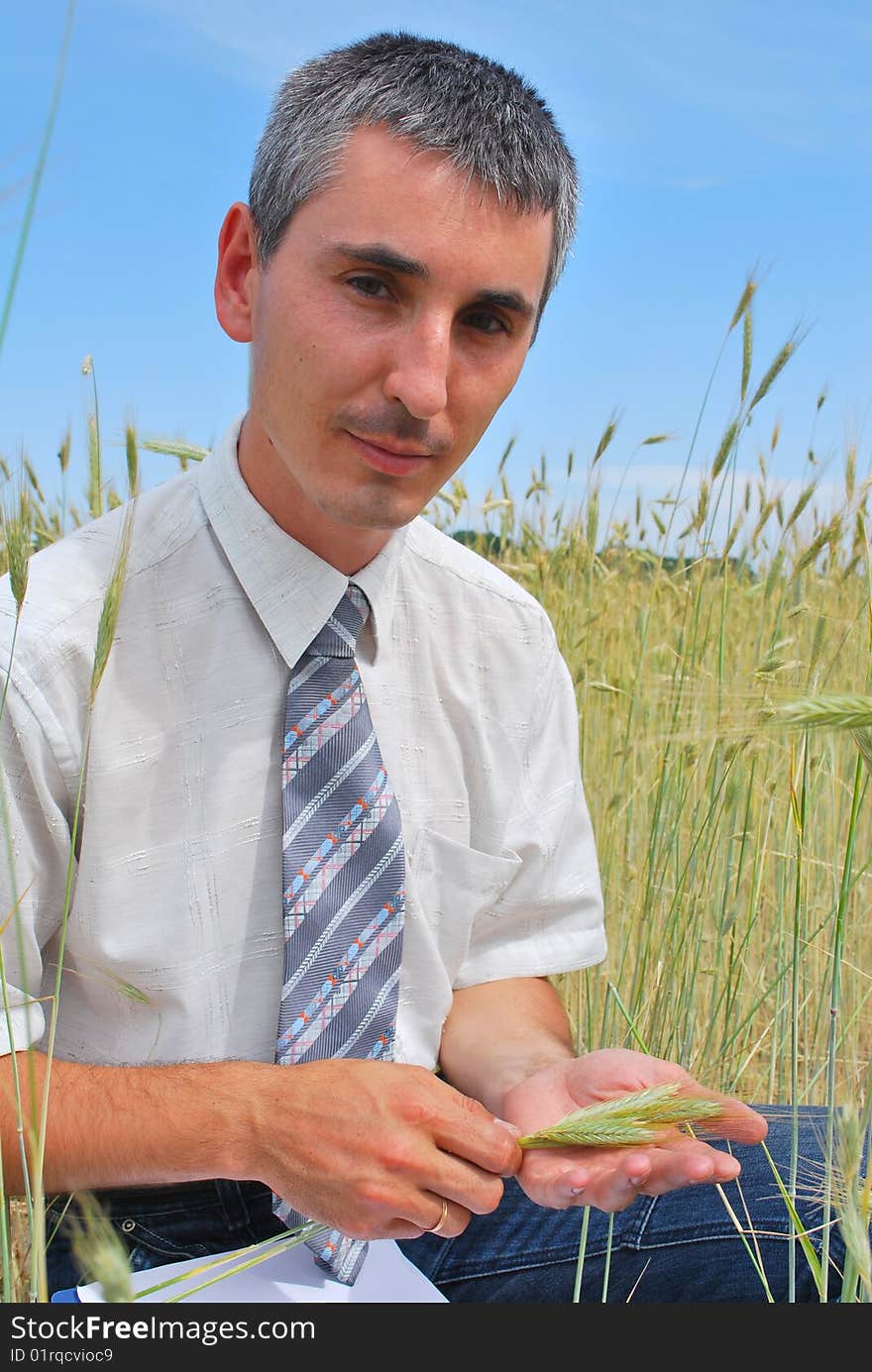 Man inspecting the wheat