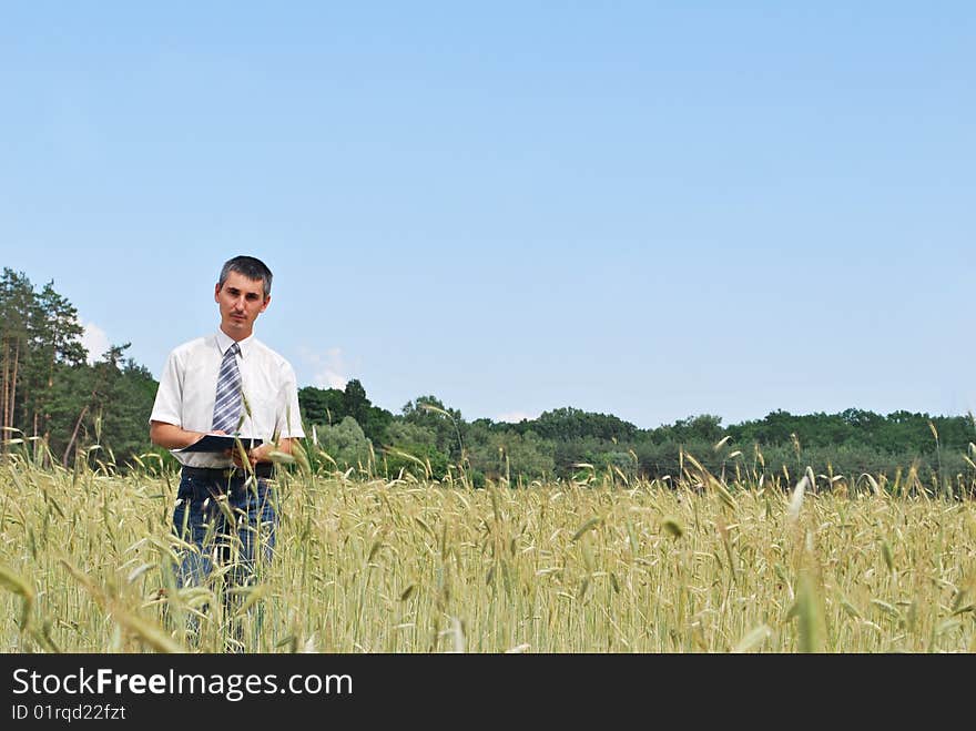 Man inspecting the wheat