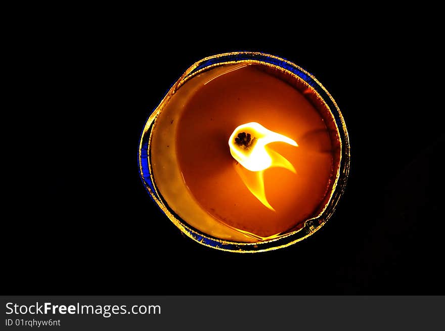 Flame of a candle against a black background