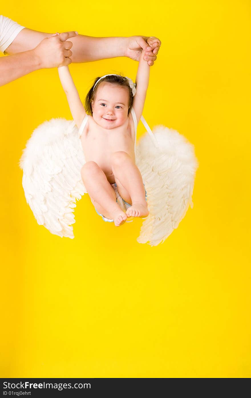 Fanny girl with angel wings on yellow