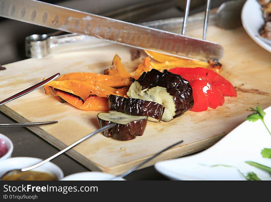 Chef cutting vegetables looking from front