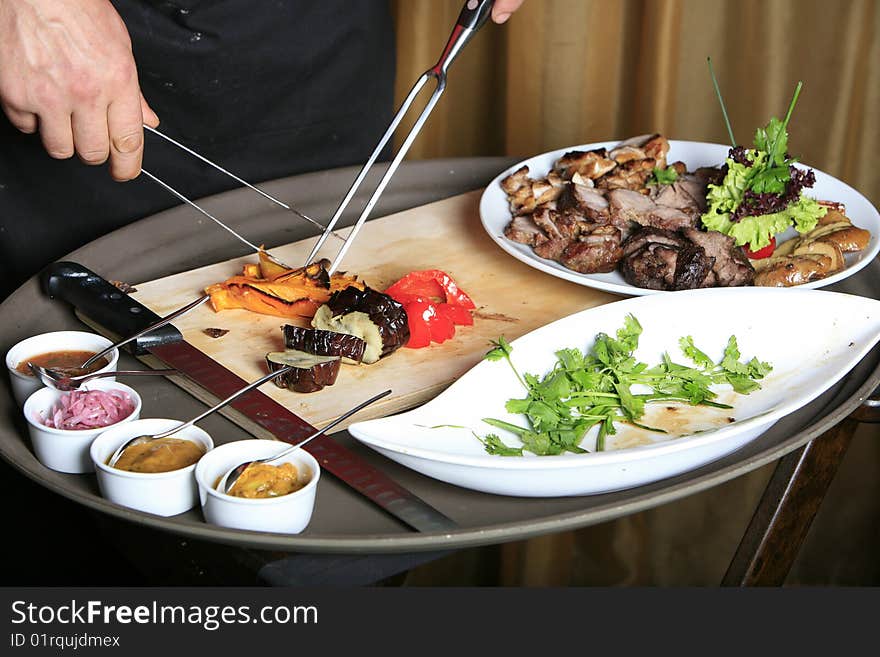 Chef cutting vegetables looking from front