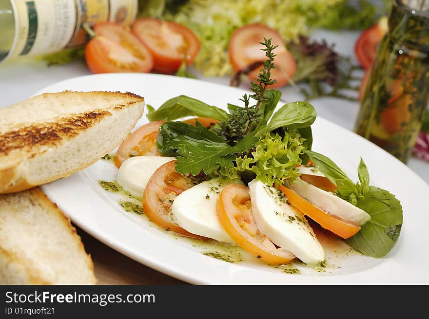 Mozzarella dish with tomato and lettuce