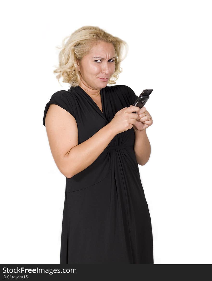 A women holding a mobile phone smiling. A women holding a mobile phone smiling