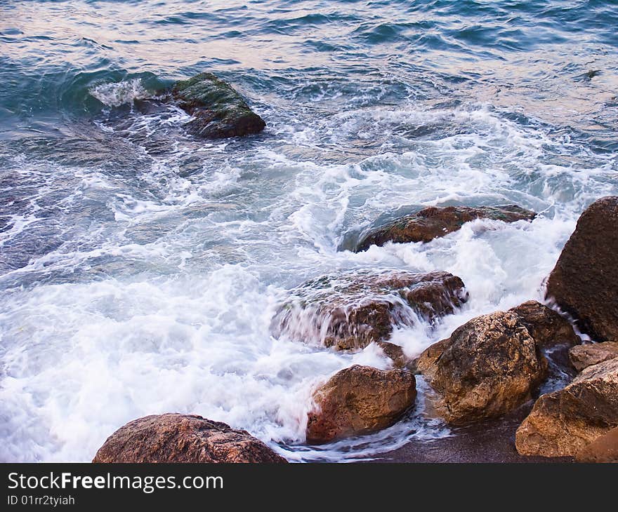 Coast of Black sea with a running wave