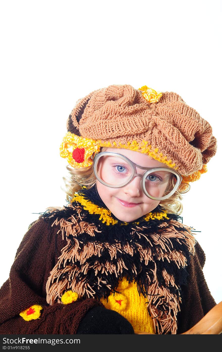 The little girl in a beautiful knitted suit