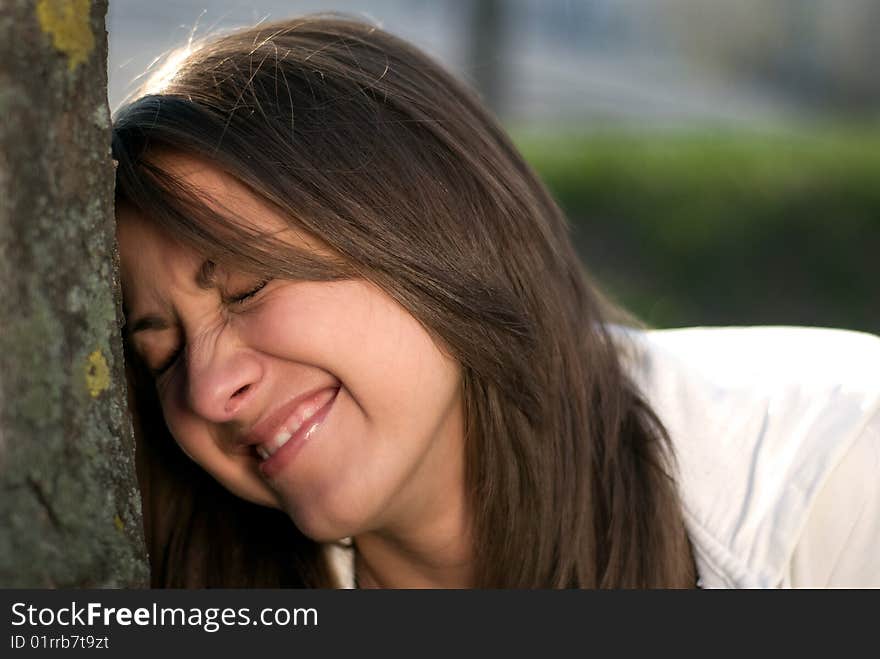 A girl laughing on a walk in a park. A girl laughing on a walk in a park