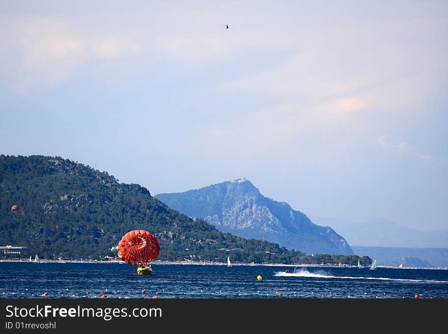 Vacation is in Turkey. Mediterranean coastline in summer day. Mountains on background.